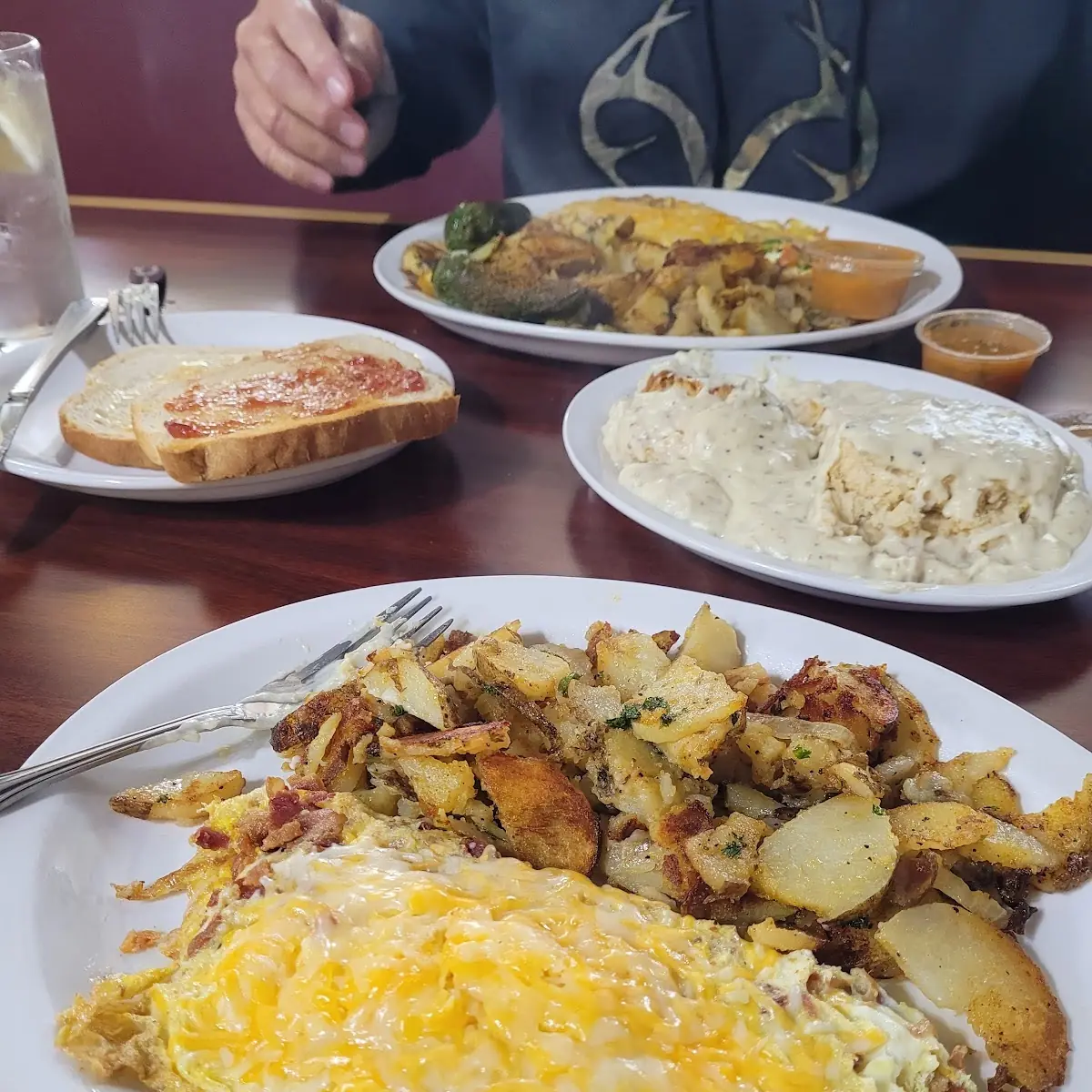 Bacon and Cheese Omelette Rodeo Potatoes and Biscuits and Gravy