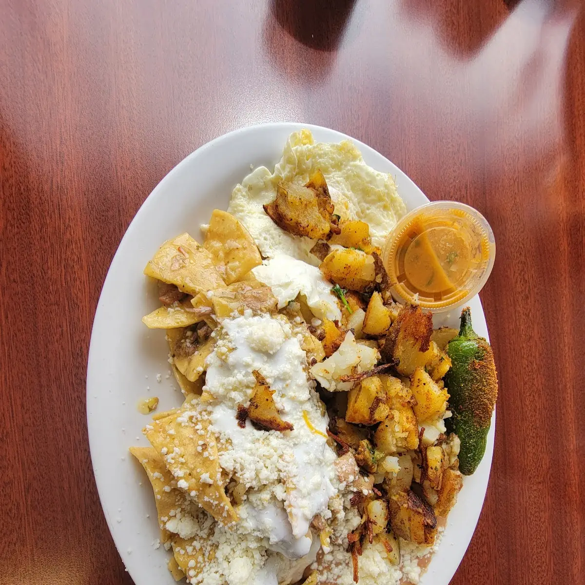 Chilaquiles Verdes and Eggs Potatoes