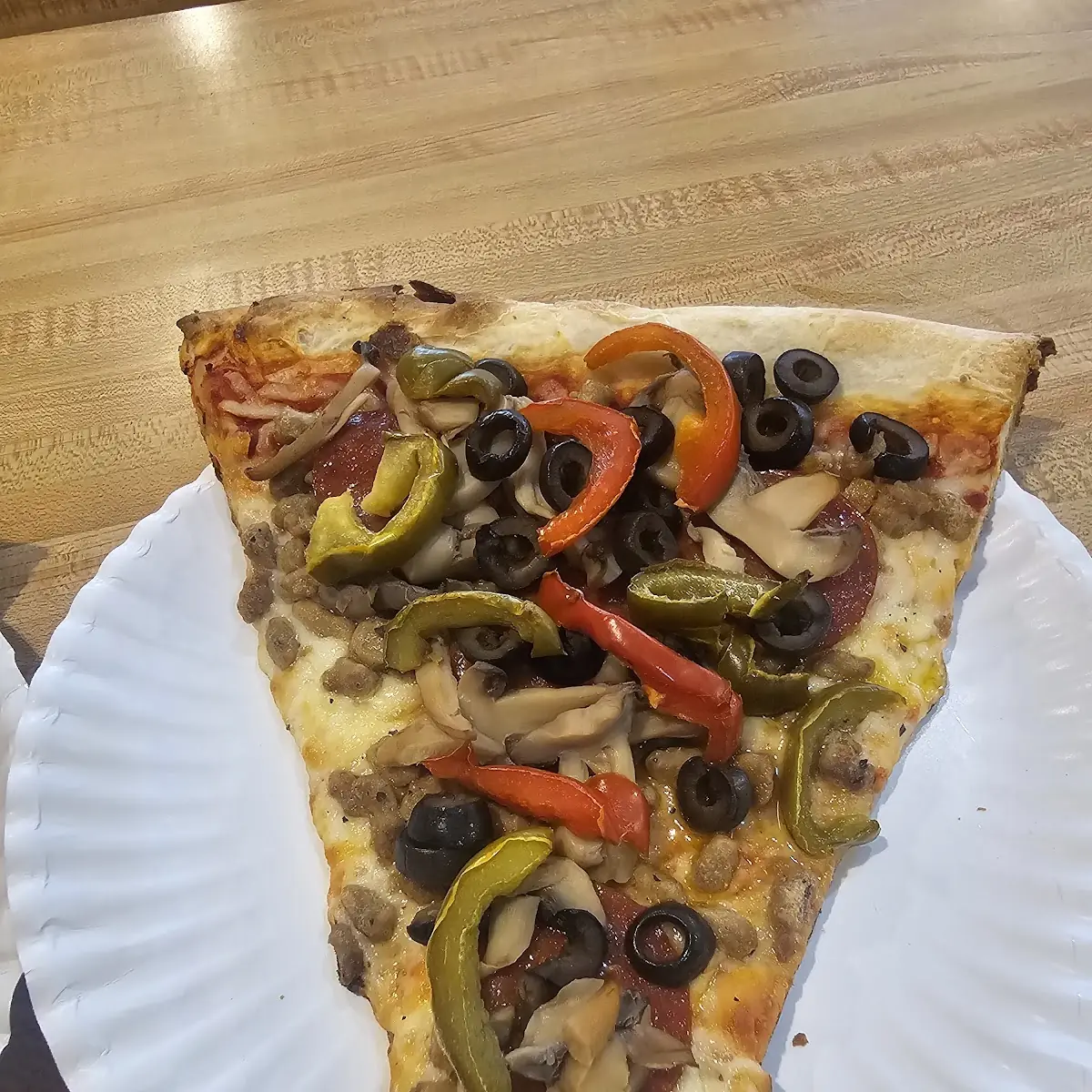 Sausage Peperoni Mushrooms and Black Olive Pizza