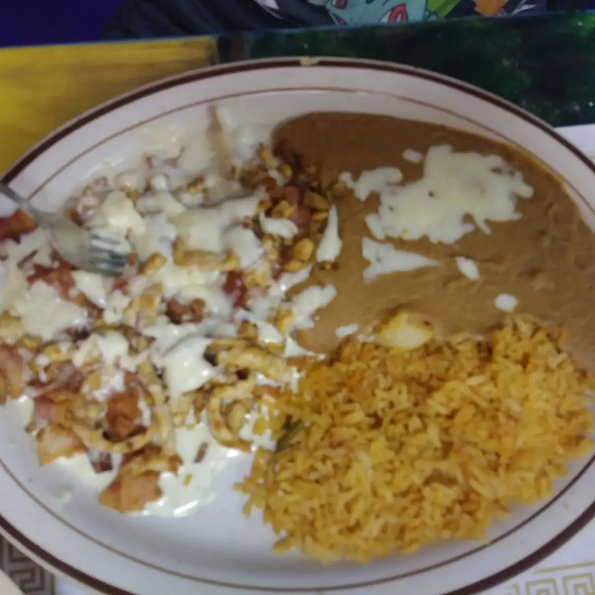 Chirizo w Blanco Cheese Sauce and Refried Beans