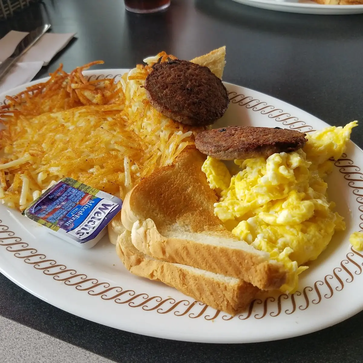 Hash Brown Potatoes and Scrambled Eggs with Sausage