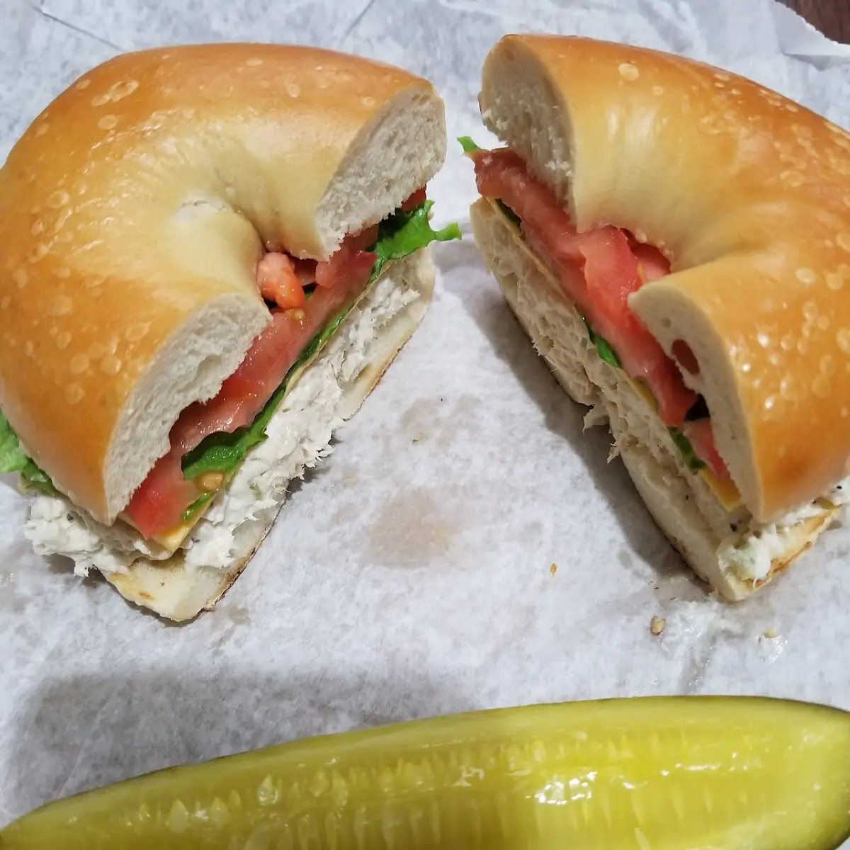 Chicken Salad on a Plain Bagel with Lettuce Tomatoes and American Cheese & a Pickle