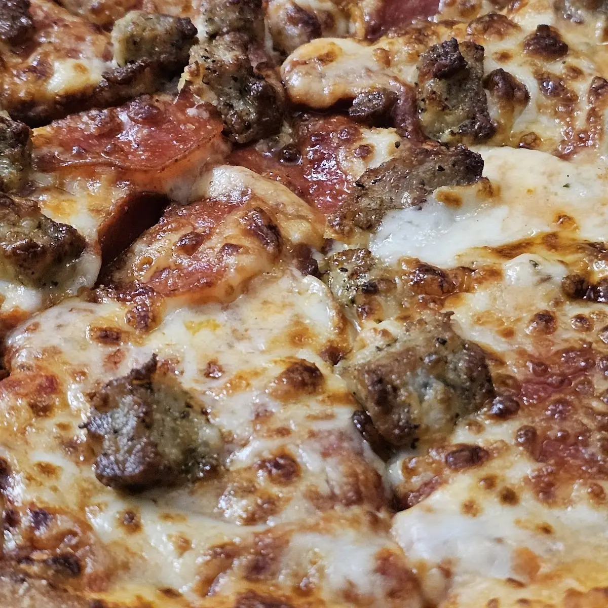 Sausage Pepperoni Extra Cheese Pizza