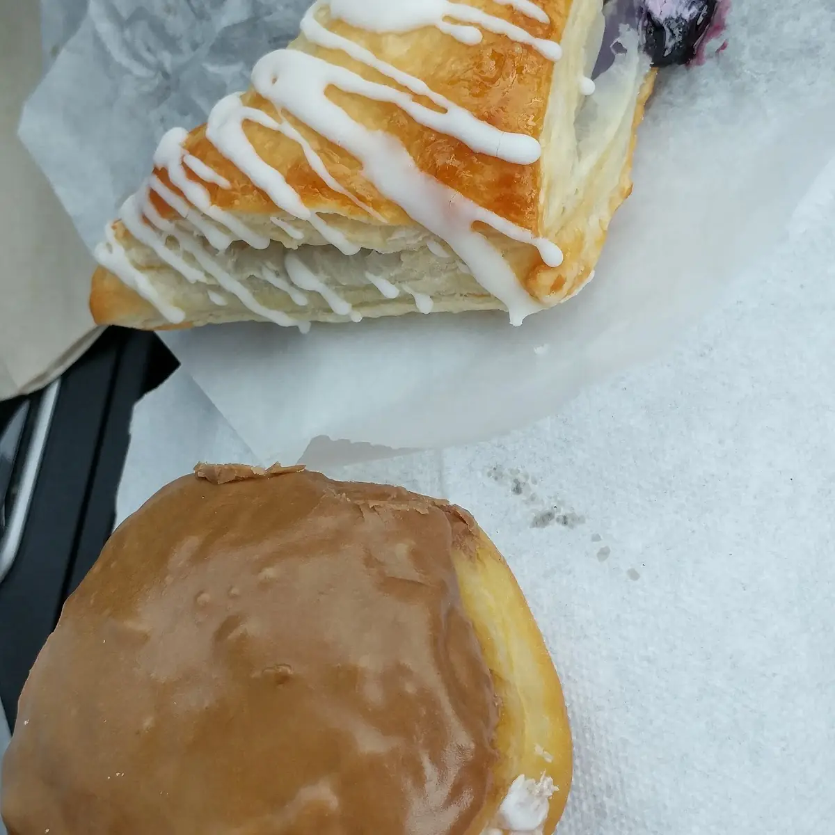Cream-Filled Maple Frosted Blueberry Turnover