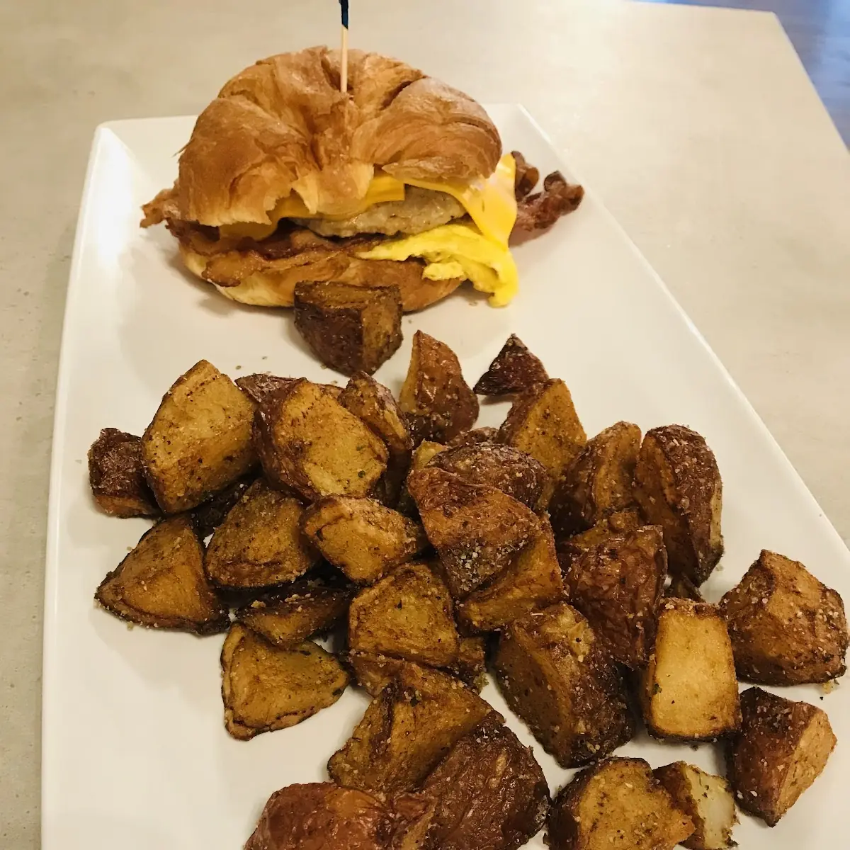Breakfast Sandwich and Potatoes