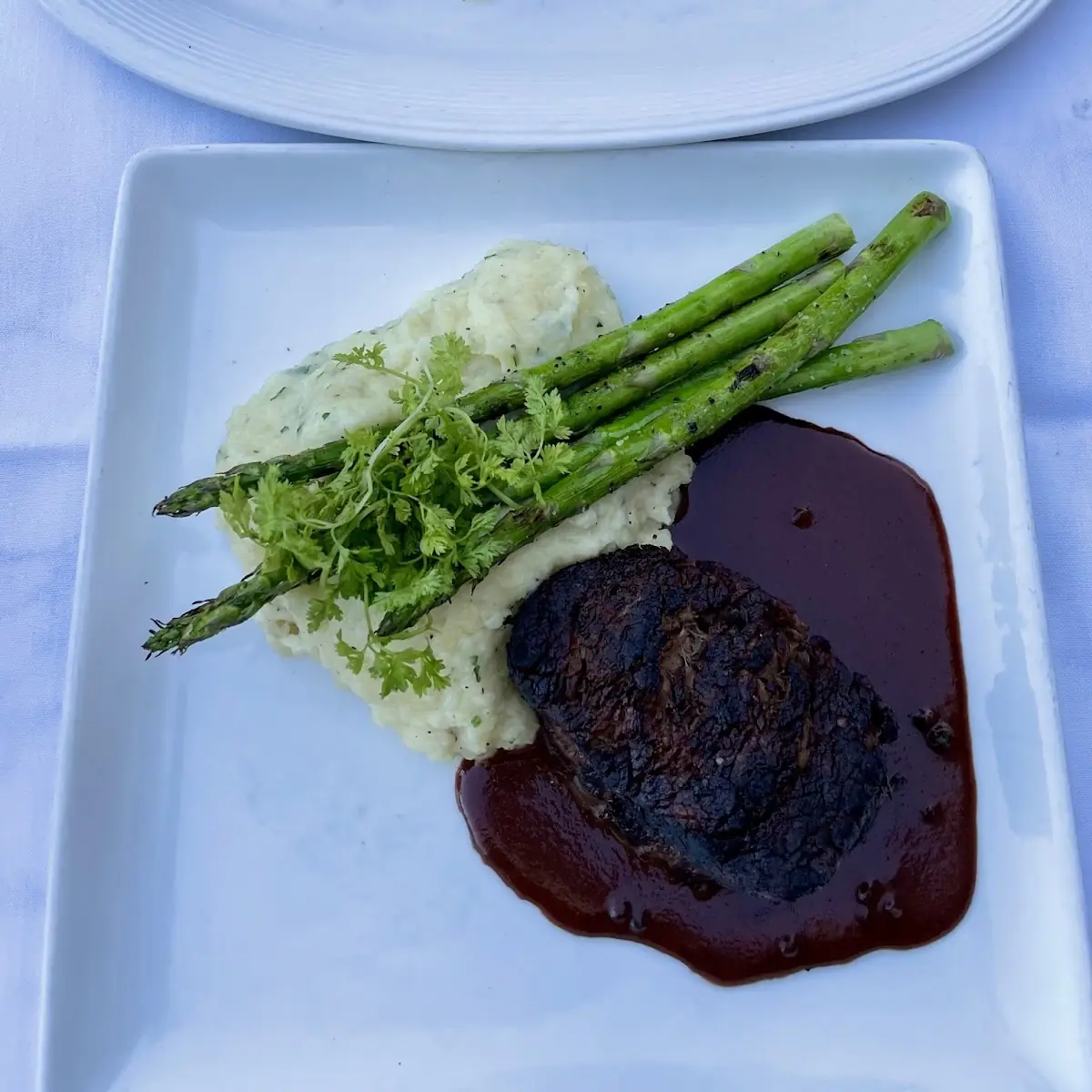Prime Beef Tenderloin 8oz with Brie Potato Puree Grilled Asparagus and Green Peppercorn Sauce