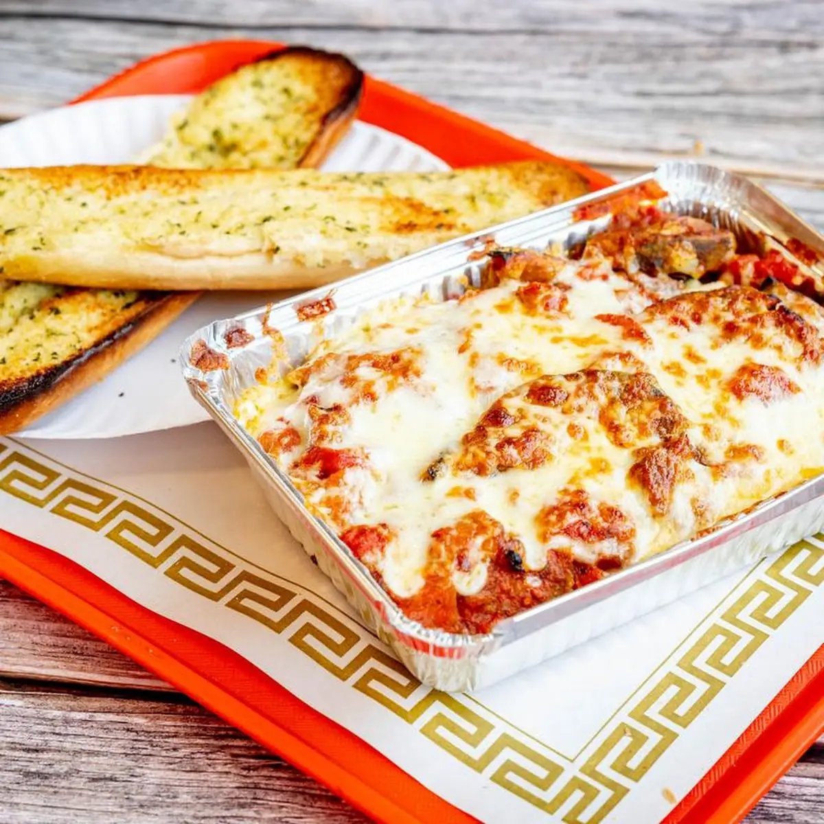 Homemade Lasagna with Sauce and Cheese and Garlic Bread