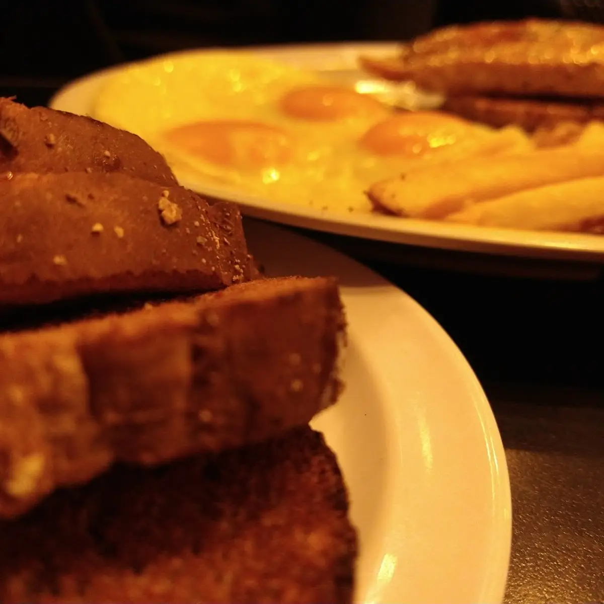 Pork Chops and Eggs with Fries and Wheat Toast
