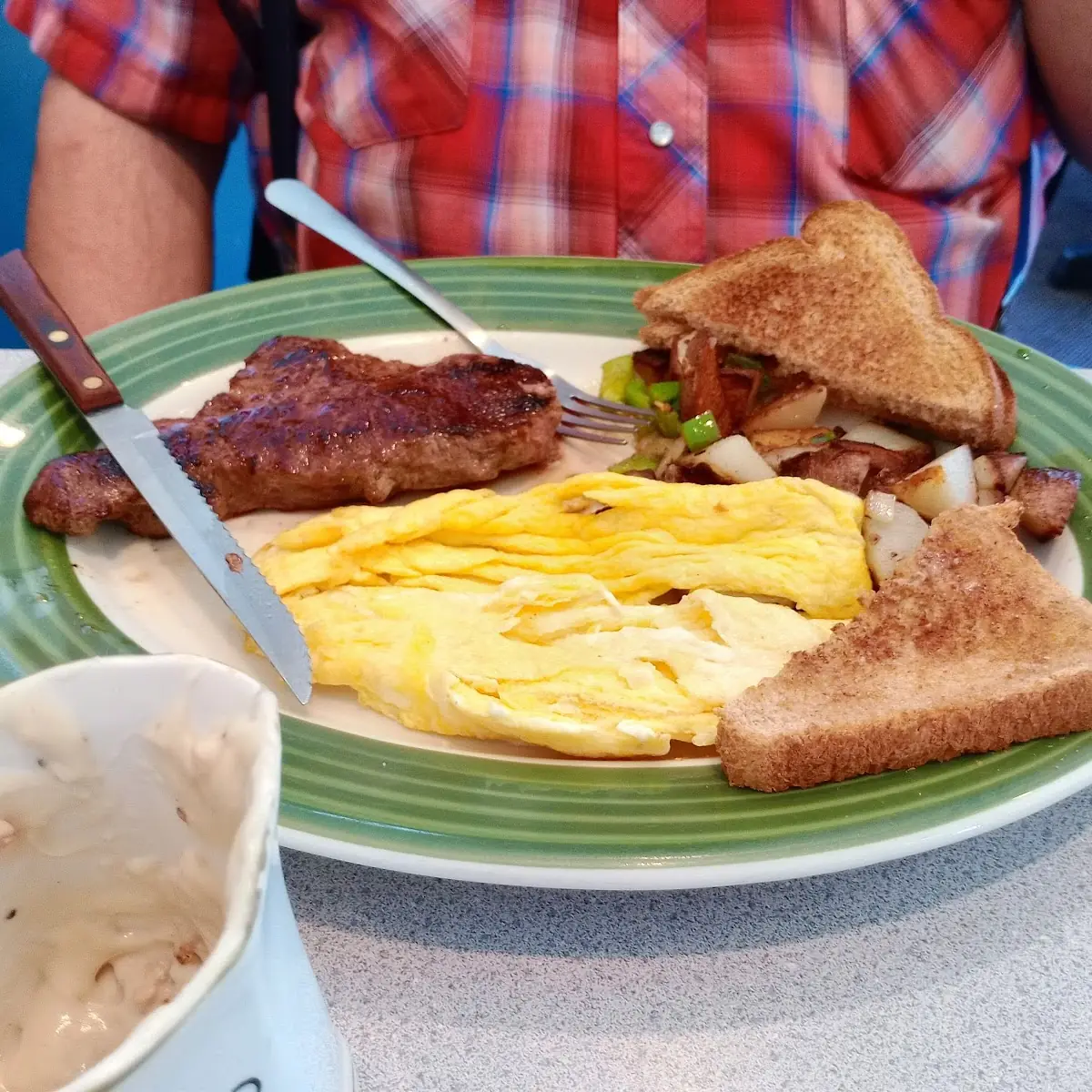 Steak and Eggs Any Style with Home Fries and Toast