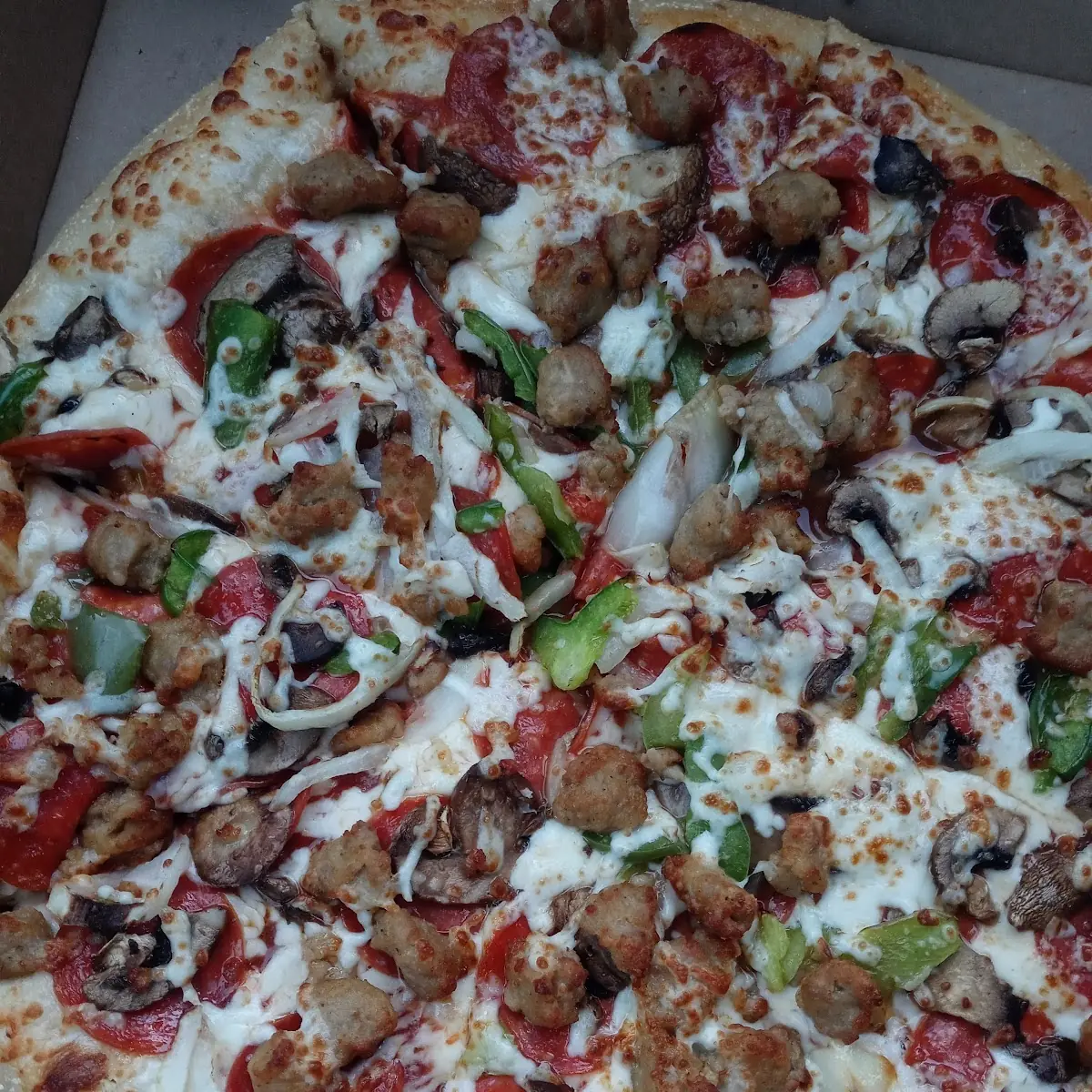 Ultimate Supreme Pizza Plus Extra Sausage and Extra Cheese