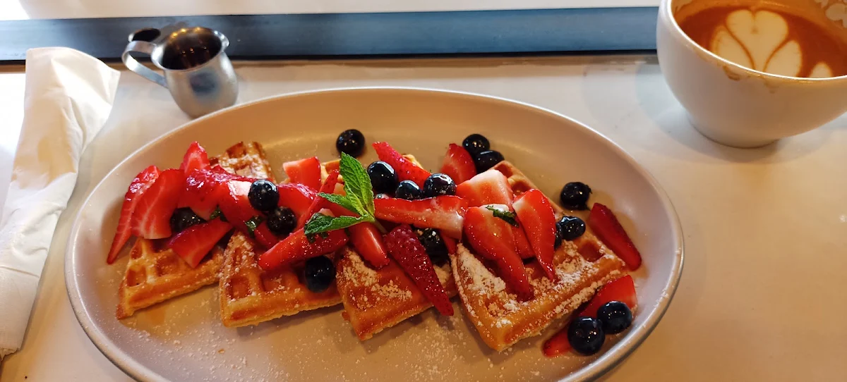 Waffles with Strawberries Maple Syrup Blueberries