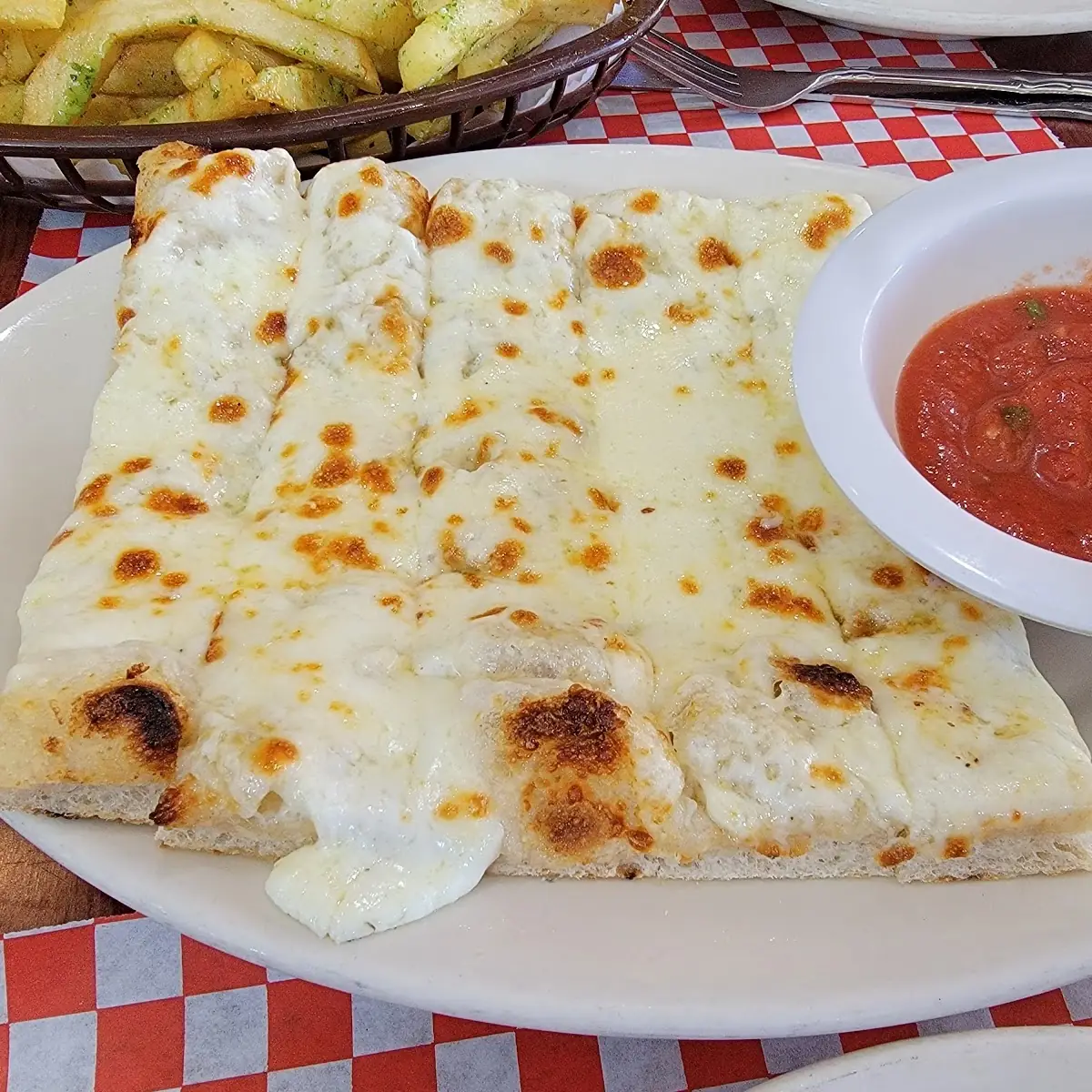 Cheesy Bread Sticks with Red Dipping Sauce