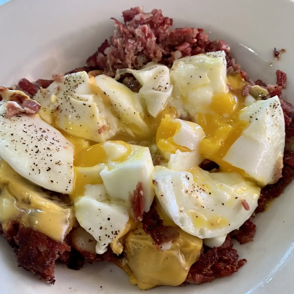 Poached Eggs Cheese and Corned Beef Hash