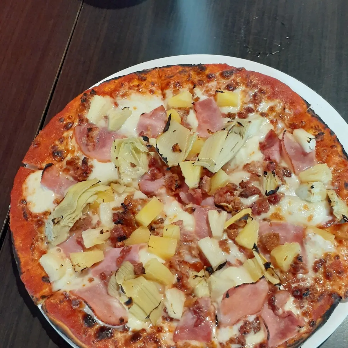 Cauliflower Chrust Pizza with Ham Bacon Pinnaple Artichoke Hearts Mozzarella Cheese