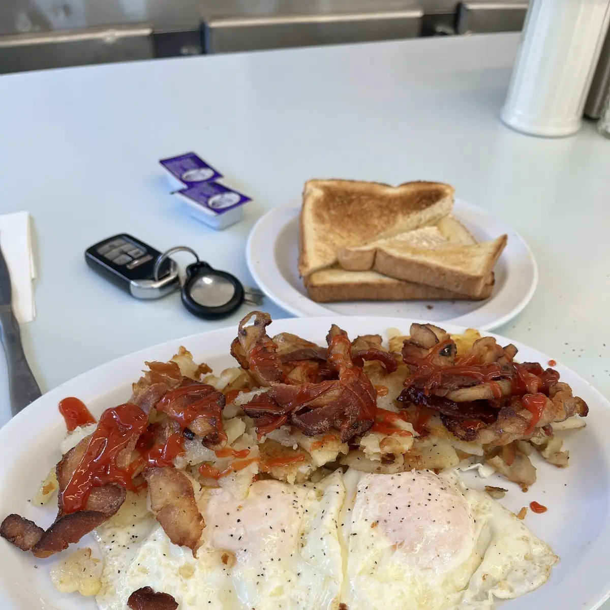 Two Eggs over Easy Well-Done Home Fries Crispy Bacon