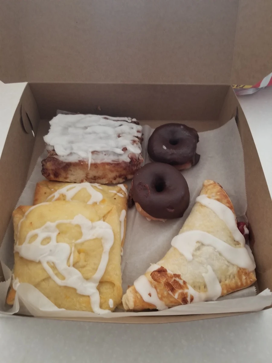 Cheese Danish Cinnamon Roll Chocolate Frosted Donuts and Cherry Turnover