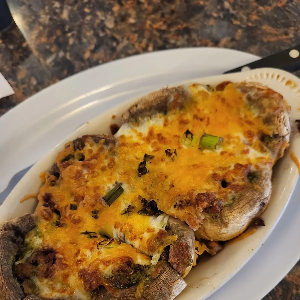 Cheesy Pesto Bacon Stuffed Mushrooms
