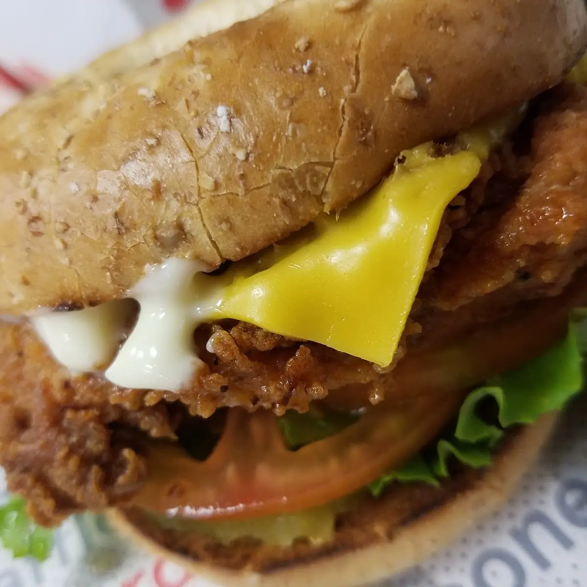 Spicy Chicken Breakfast Sandwich with Added Tomato Lettuce & Pickles