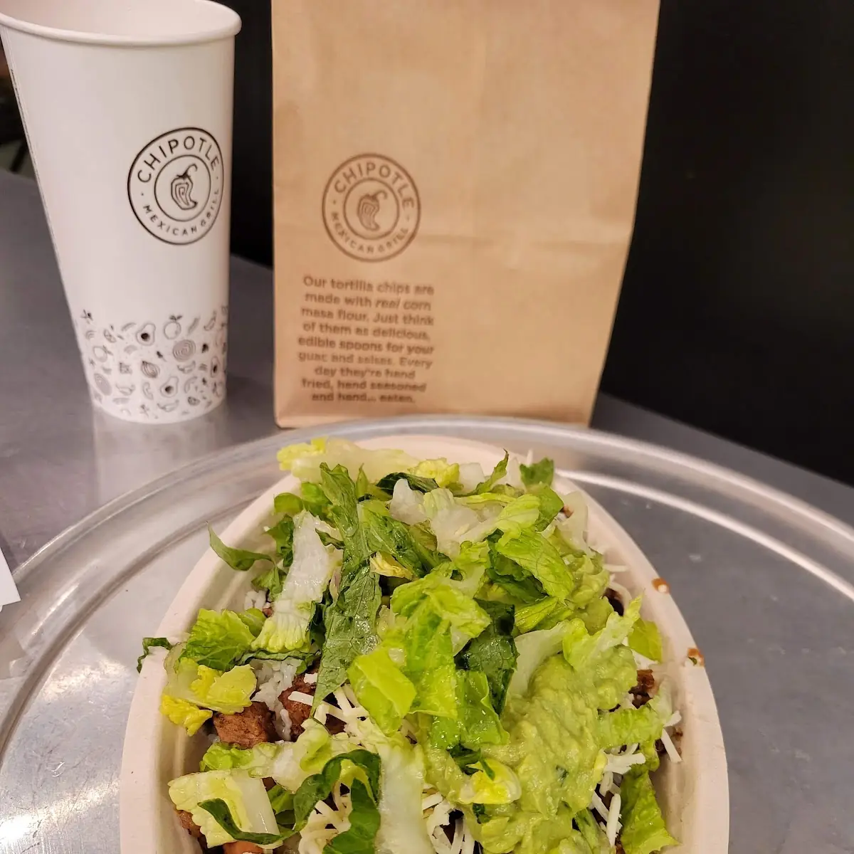 Steak Bowl with White Rice Pinto Beans Lettuce and Guacamole