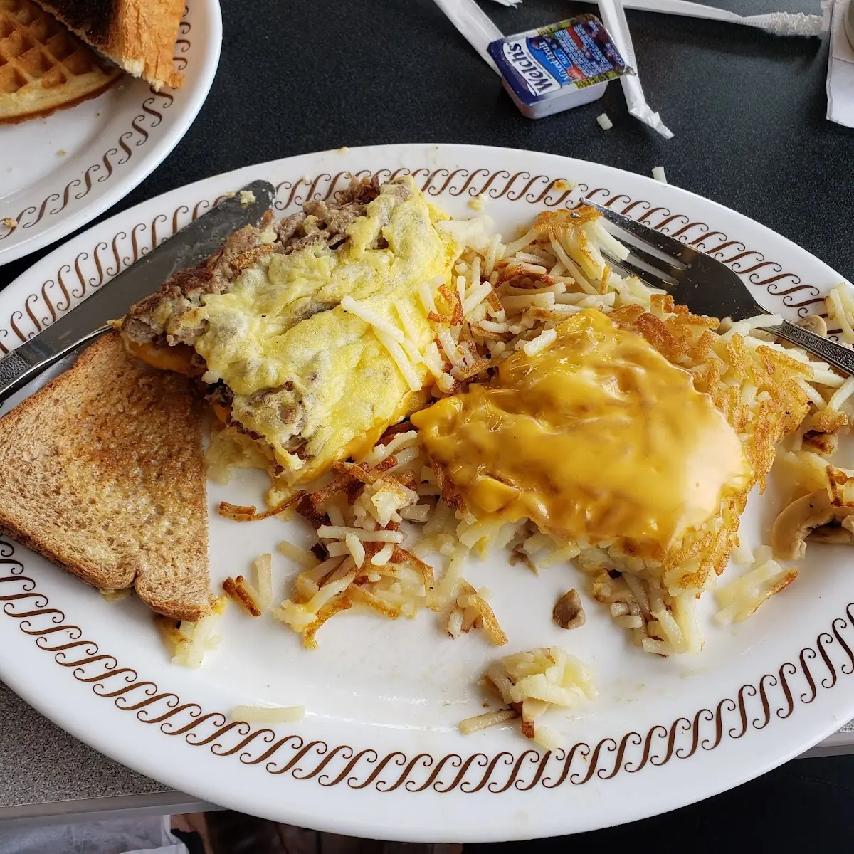 Texas Cheese Melt Omlet Hash Browns Scattered Covered and Capped