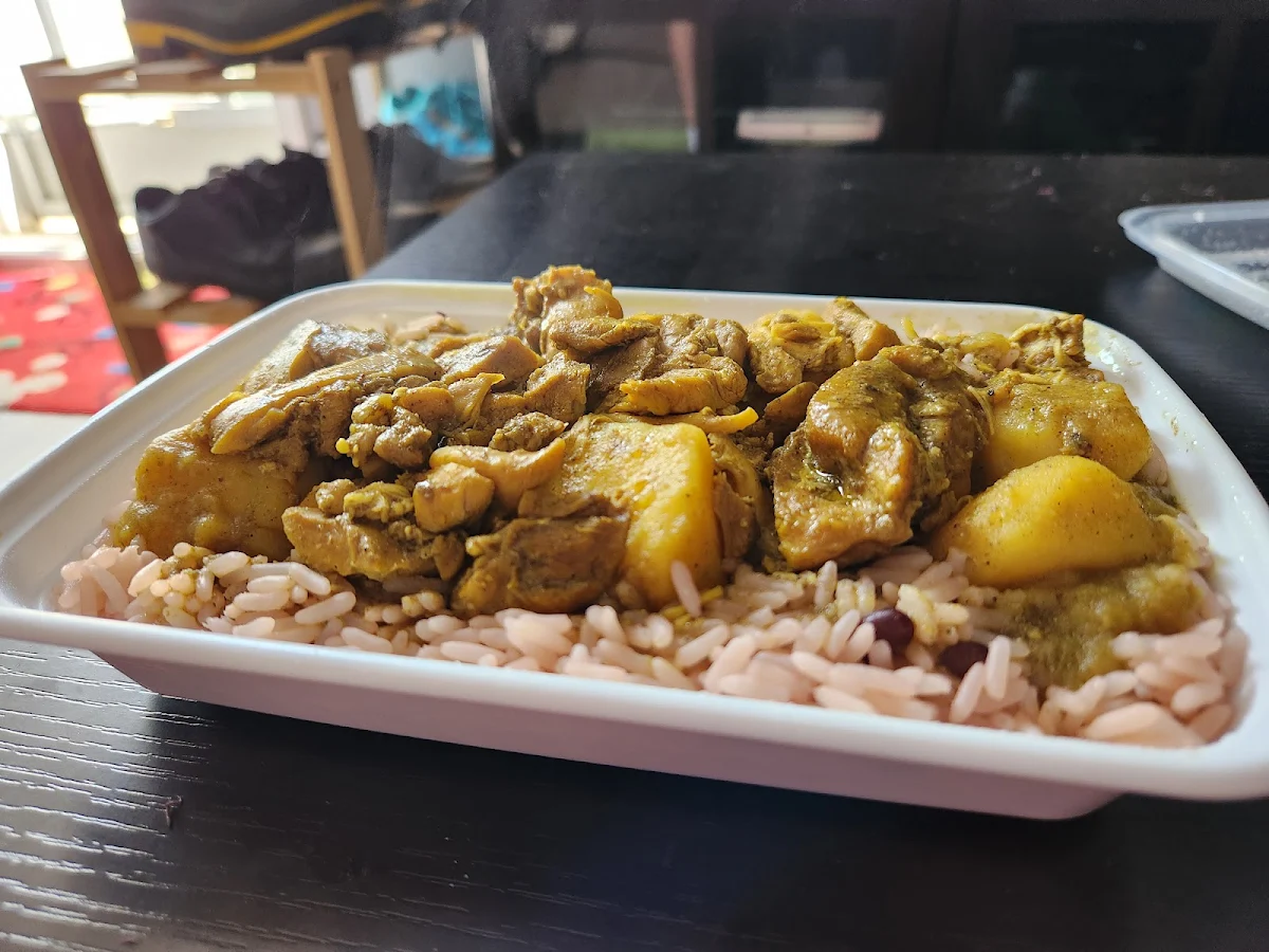 Boneless Chicken Curry on Rice and Peas