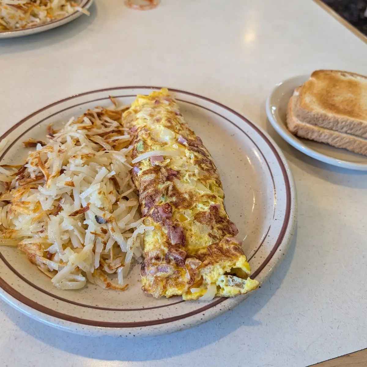 One Biscuit and Gravy with Hash Browns Egg with an Extra Side of Crisp Bacon