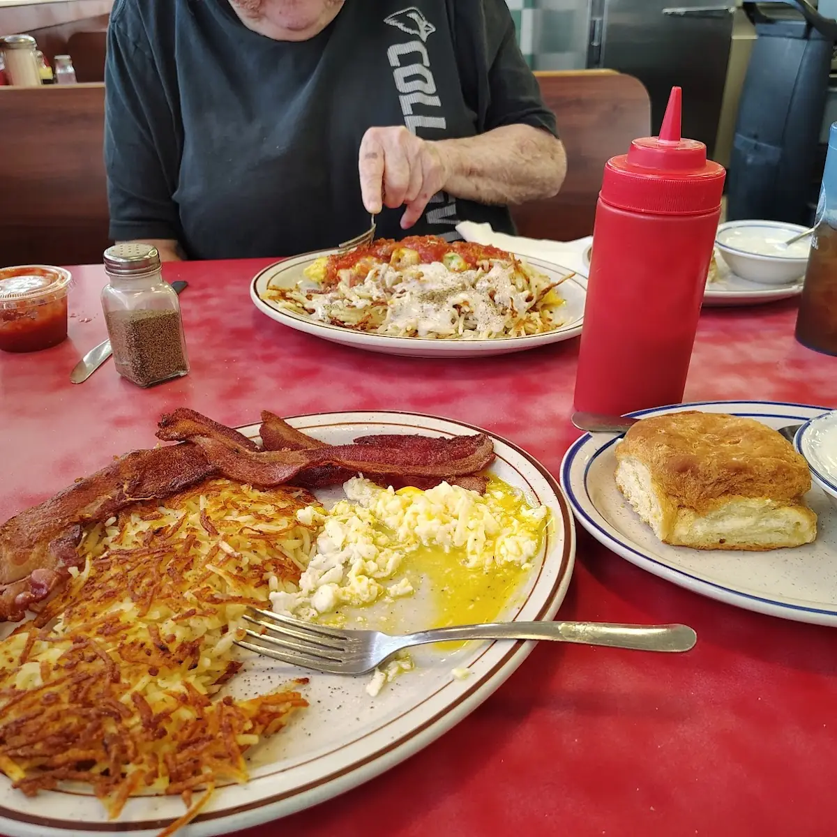Biscuits and Gravy with Eggs Bacon and Hash Brown
