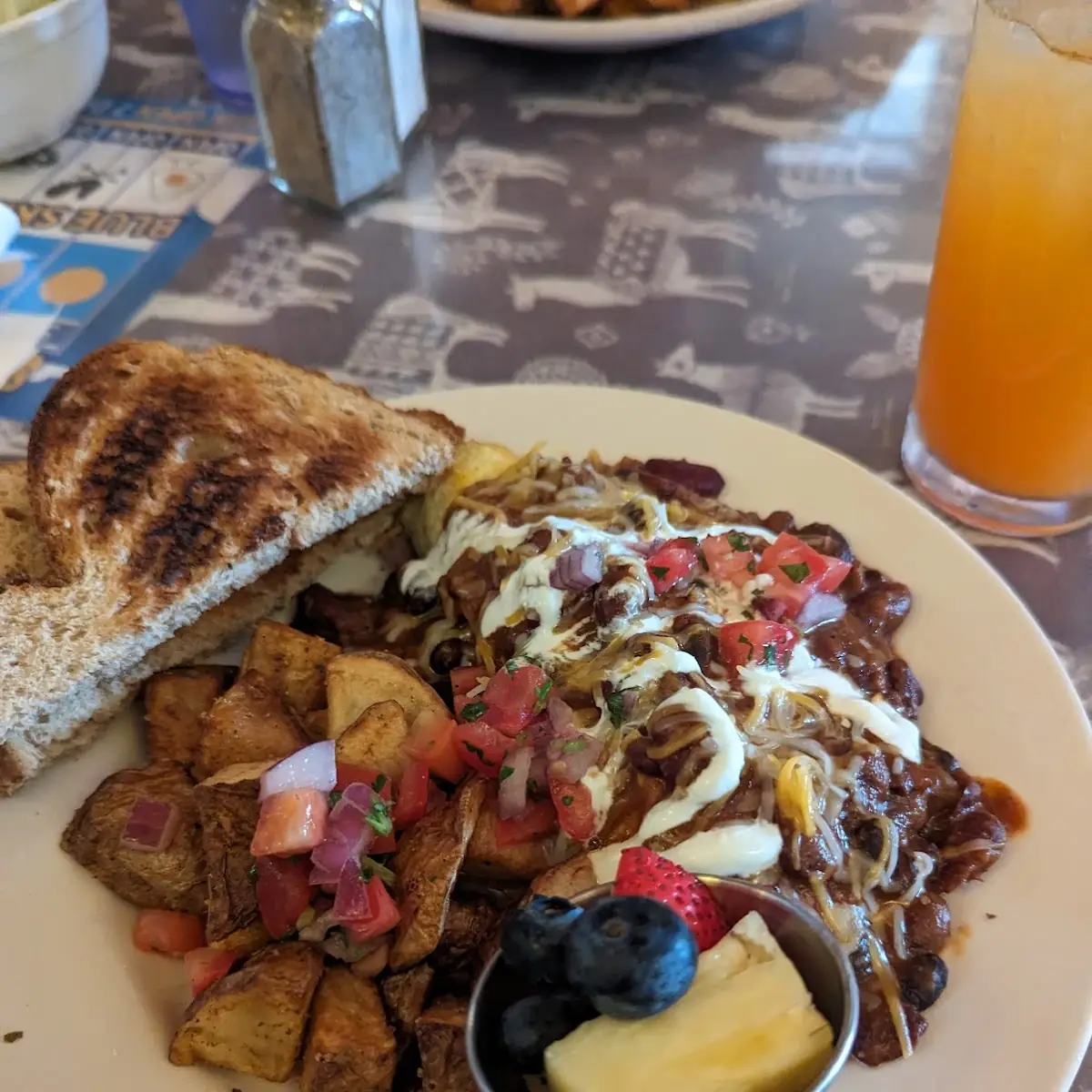 Eggs Benedict with Home Fries and Fruit