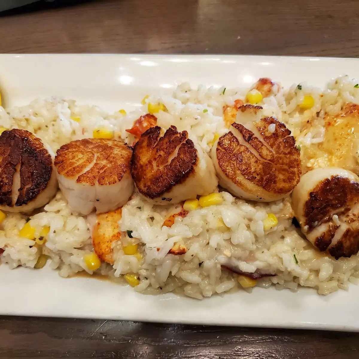 Pan-Seared Sea Scallops over Lobster Corn & Truffle Risotto