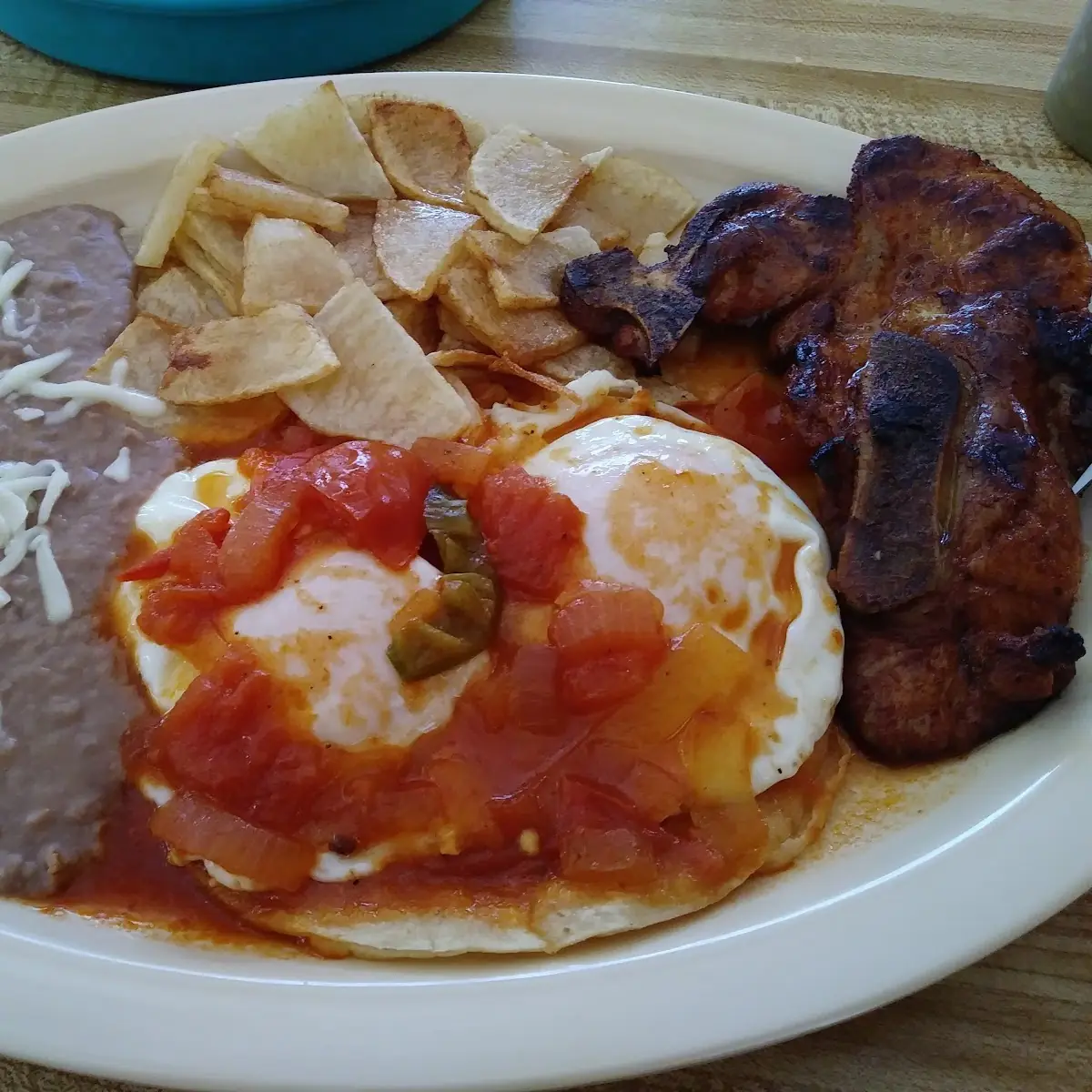Chuleta Con Huevos Estrellados