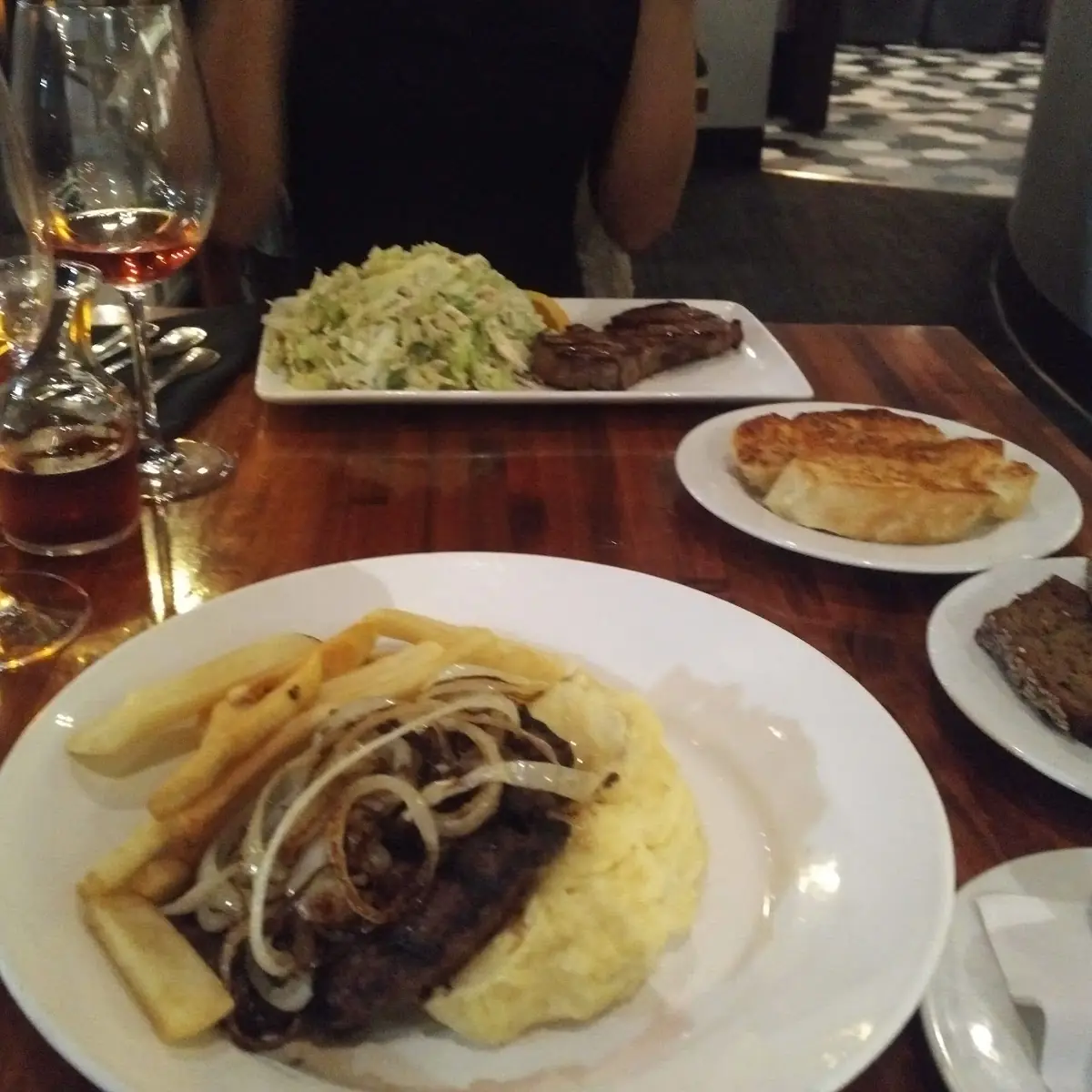 Mackey's Chopped Steak with Grilled Onions and Our Housemade Steak Sauce and Choice of Sides