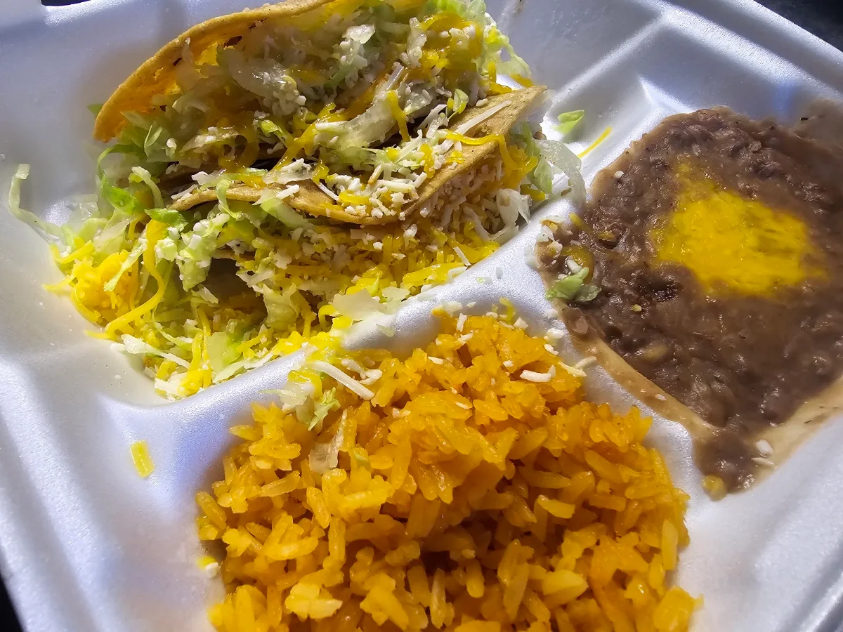 Combo 1 Two Hard Shell Tacos with Rice and Beans