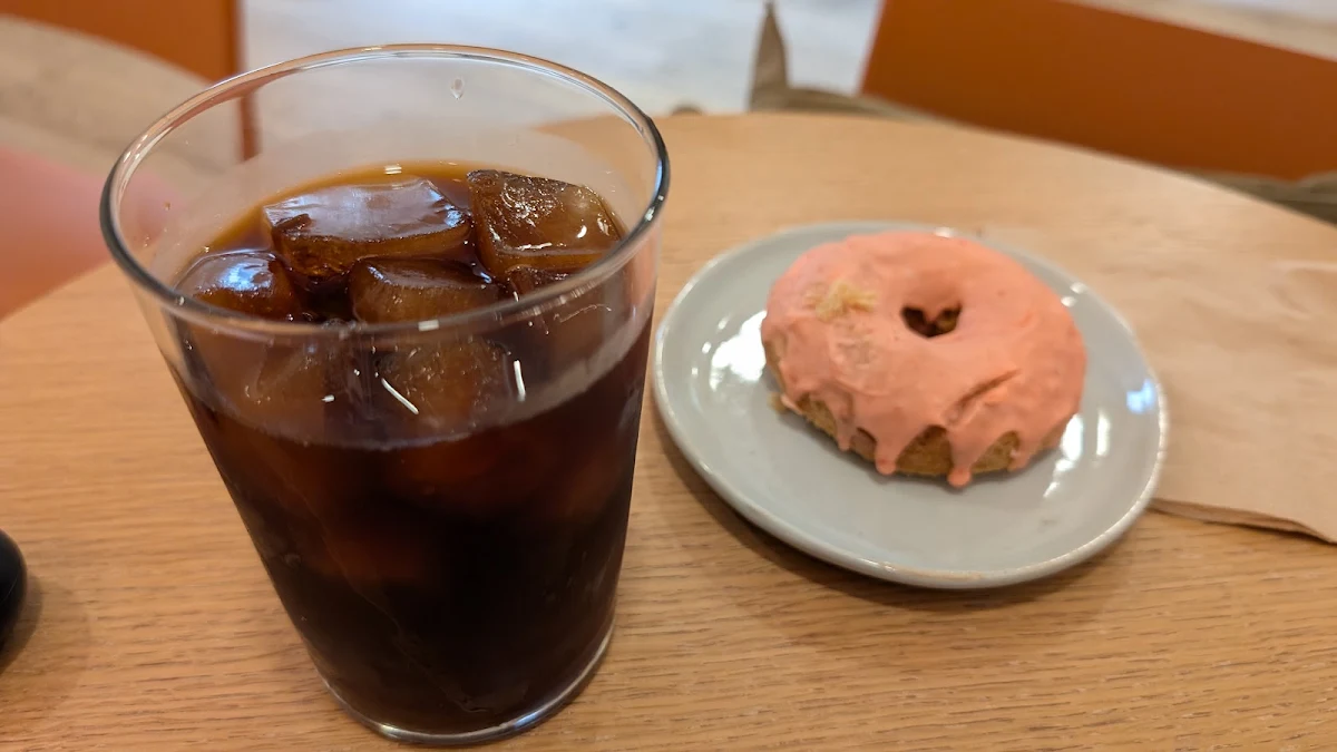 A Pink Donut with Cold Brew Coffee