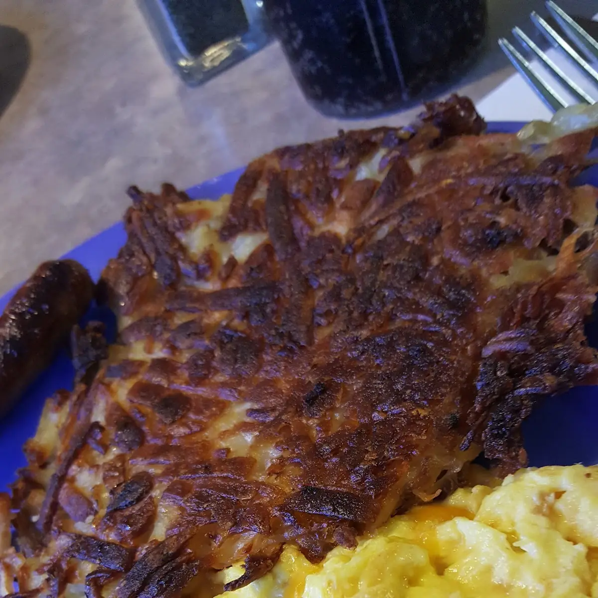 Scrambled Eggs with Cheddar Cheese Hash Browns Well Done Sausage Well Done