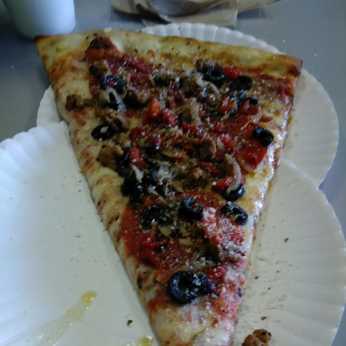 Pizza Slice with Pepperoni Black Olives and Sausage
