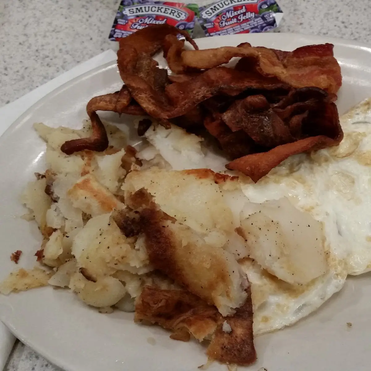 Breakfast Special 4 Two Eggs over Medium White Toast and Crispy Bacon