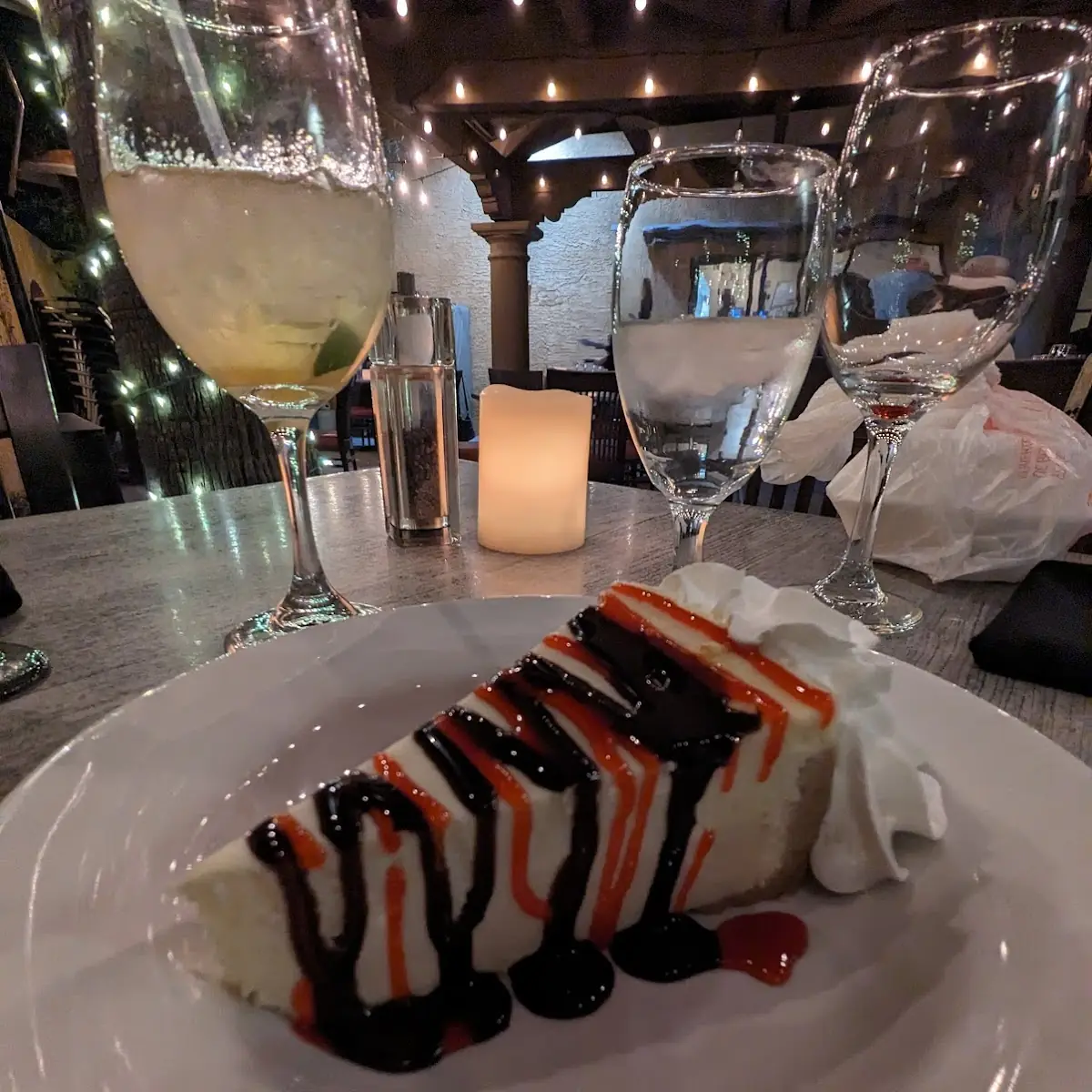 Cheesecake Slice with Chocolate and Raspberry Drizzle