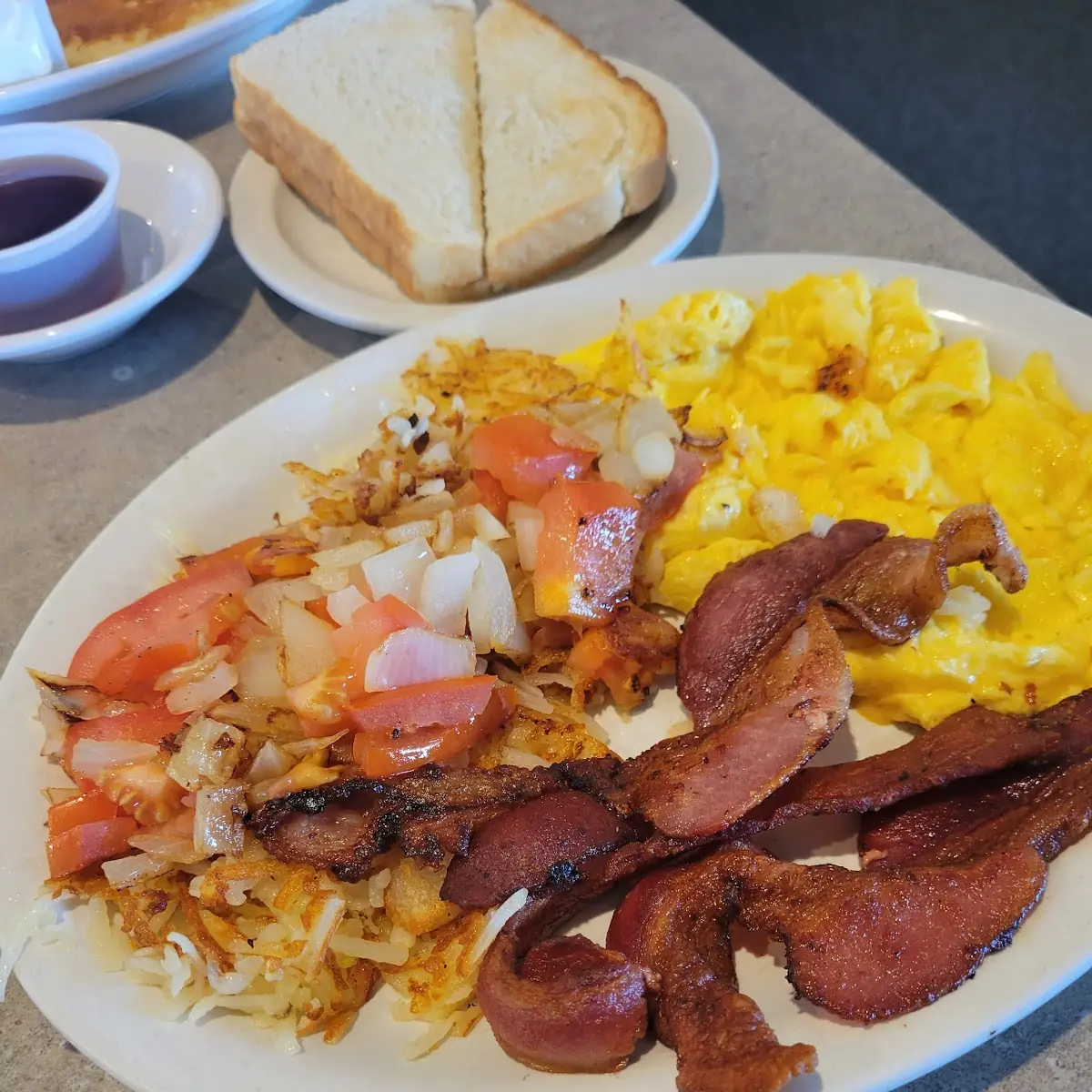 Hash Brown Eggs and Bacon with Onions and Tomatoes