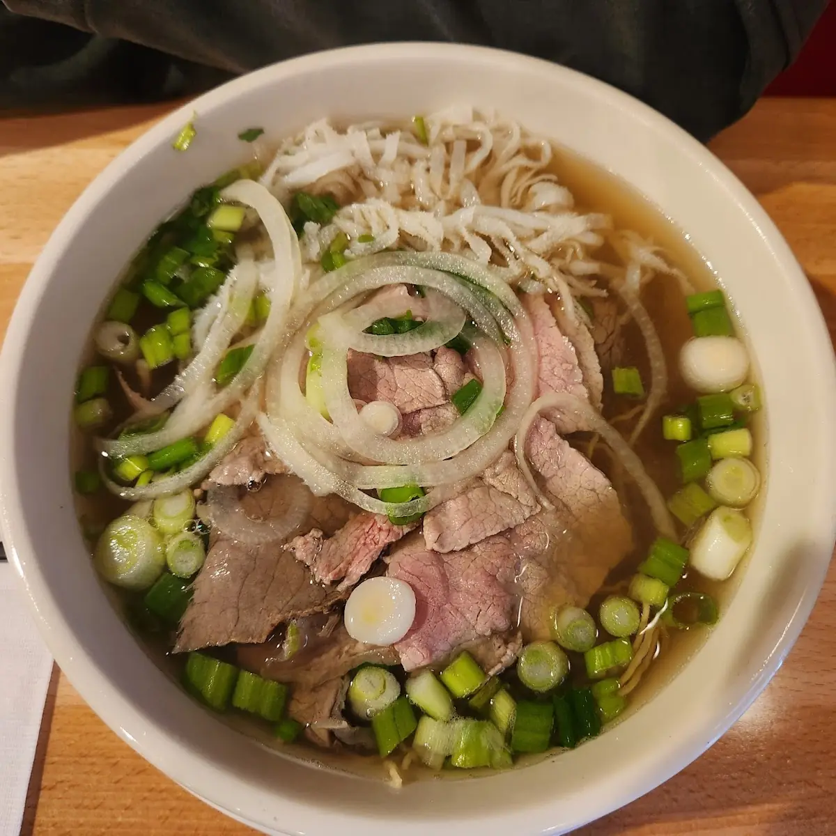 Steaming Beef Pho with Fresh Herbs