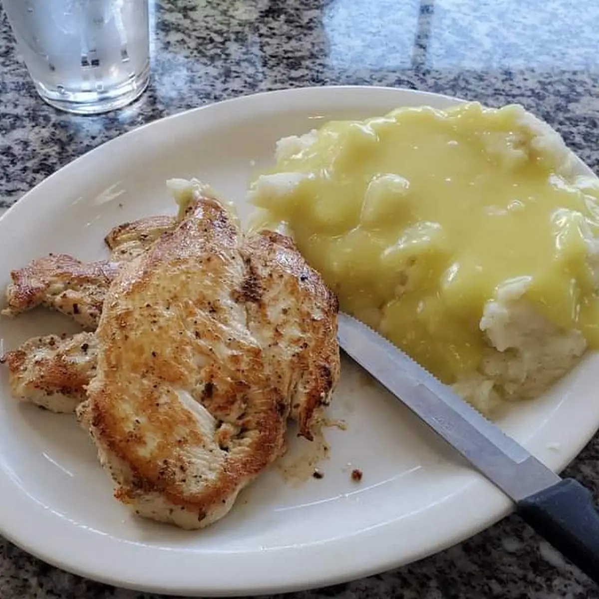 Grilled Chicken Breast Dinner with Mashed Potatoes and Gravy