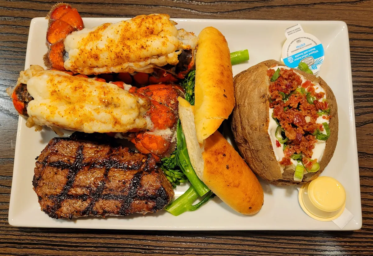 Steak and Lobseter Tails with Loaded Baked Potato
