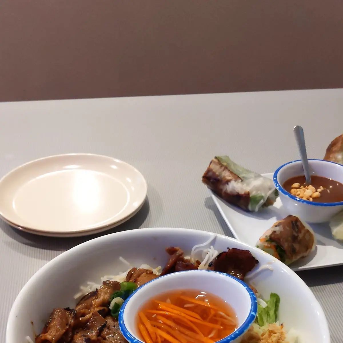 Bún Thịt Nướng (Grilled pork w/ rice vermicelli noodles, lettuce, cucumber, carrot, peanuts + fish sauce)