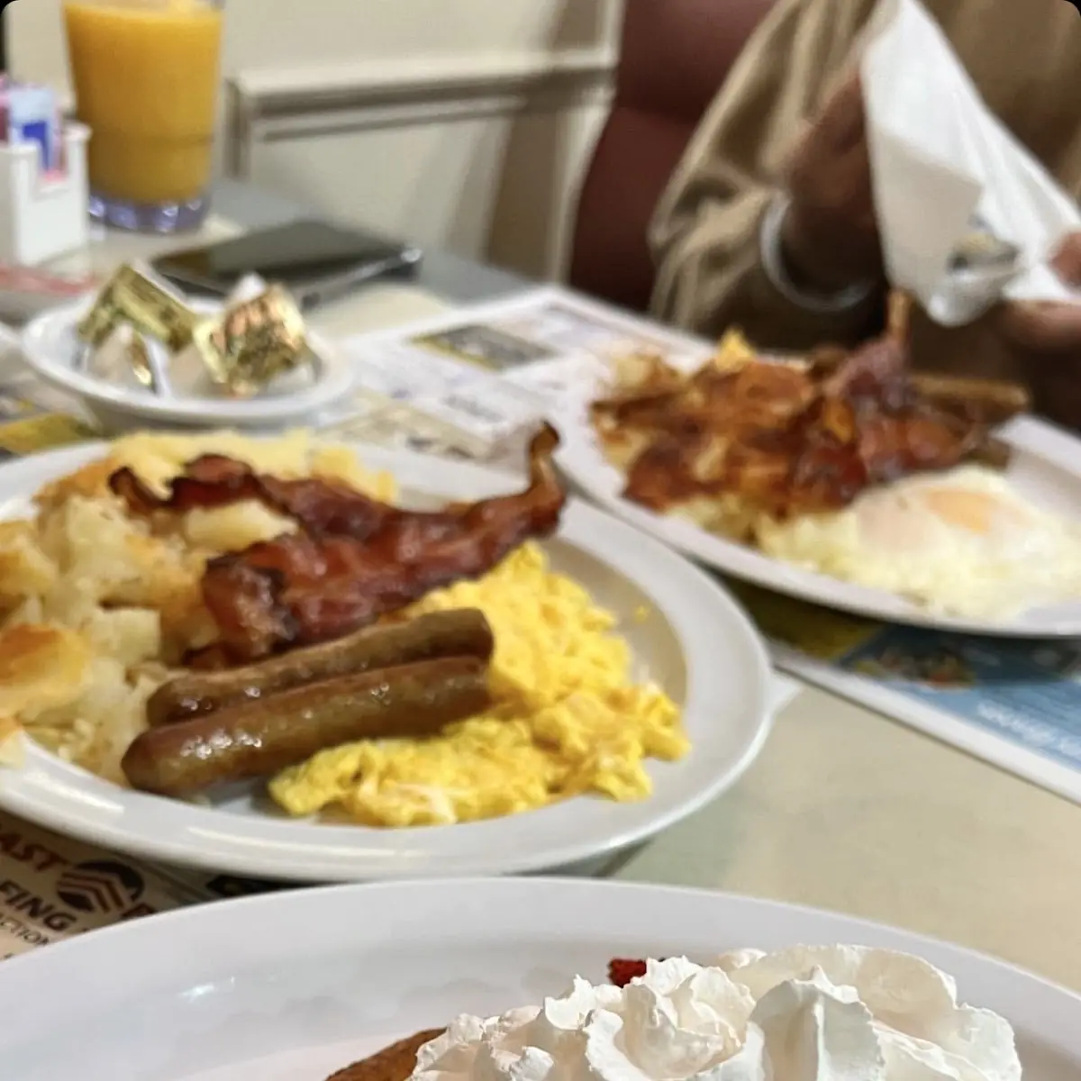 Two Hot Cakes & Two Eggs with Bacon & Sausage