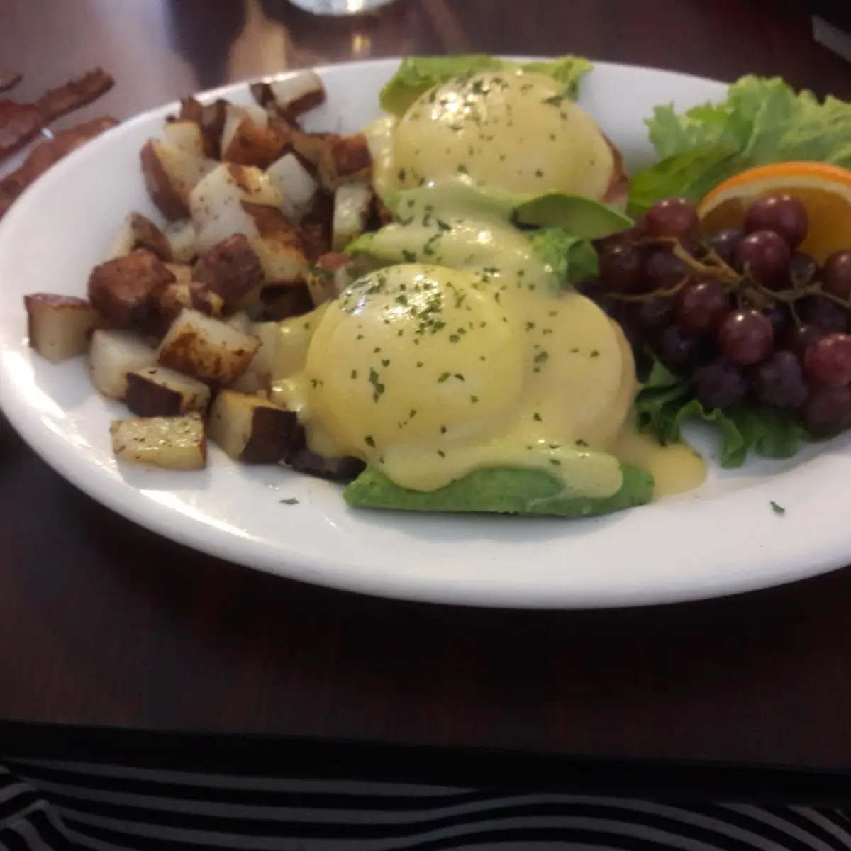 California Benedict with Fresh Tomato and Avocado Served with Home-Style Potatoes