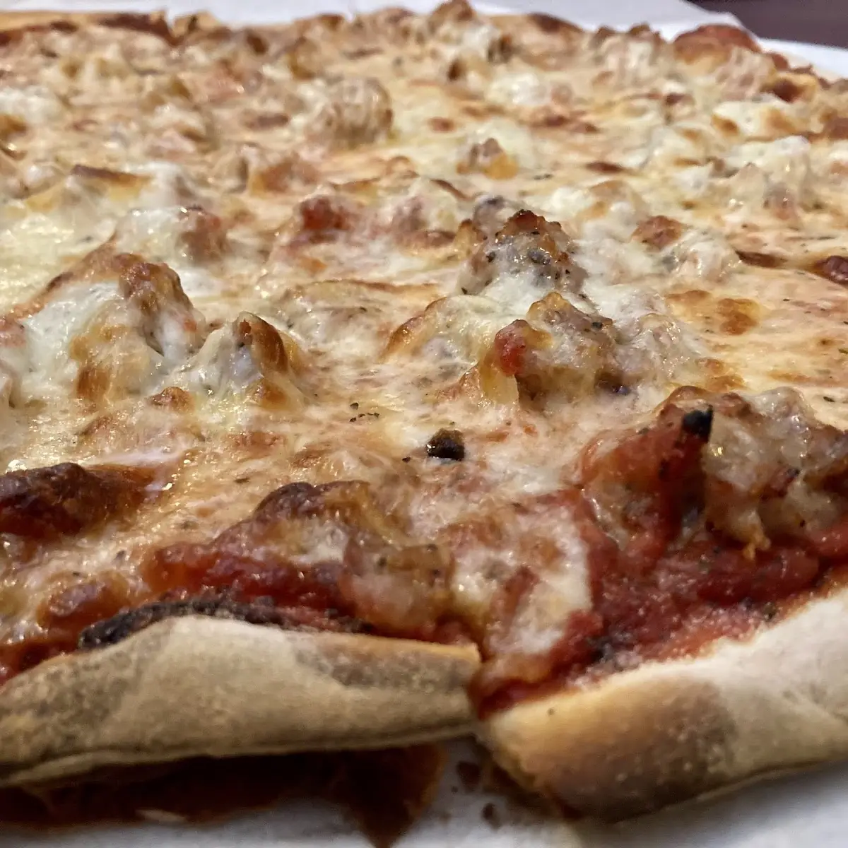 Thin Crust Cheese and Sausage Pizza