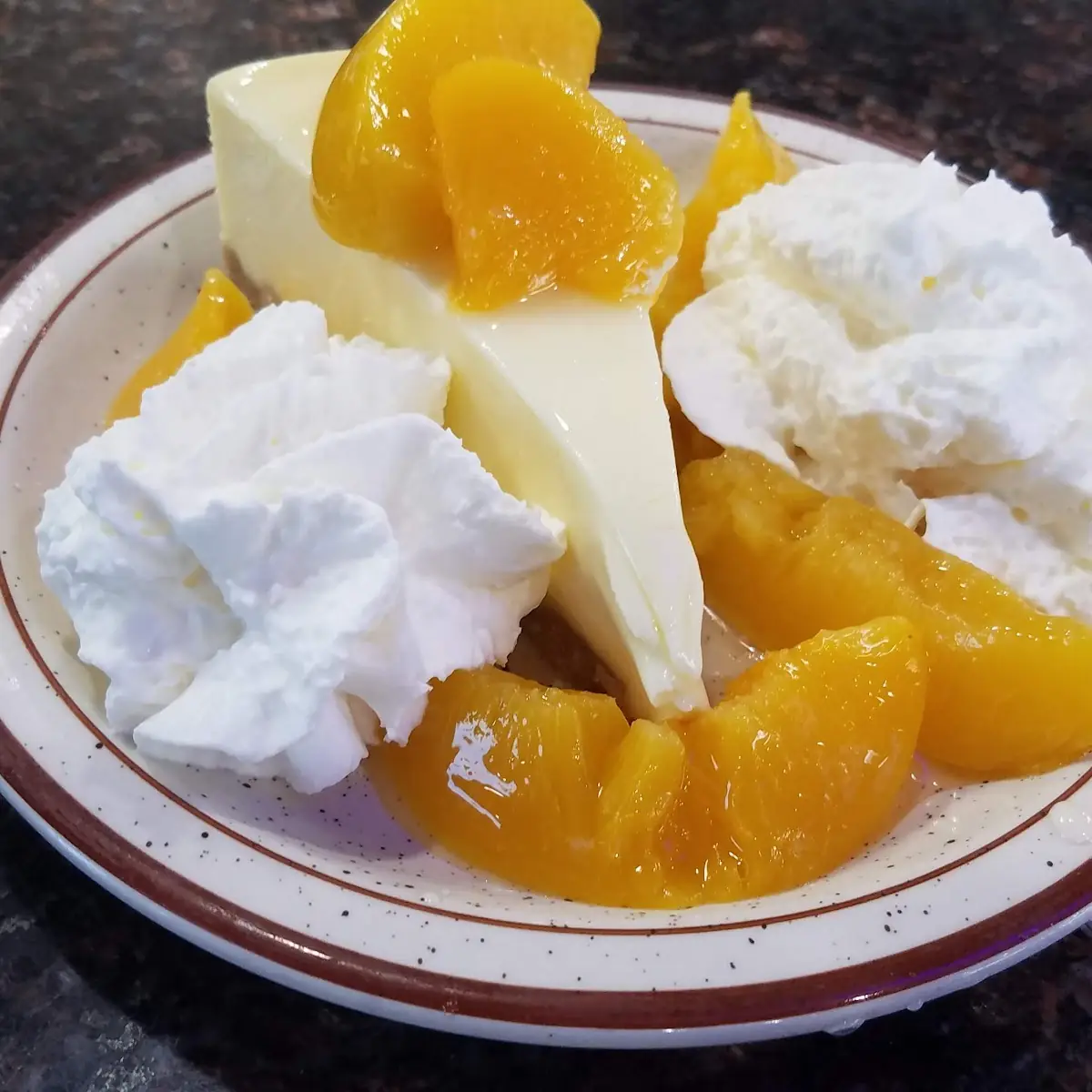 Cheese Cake with Peaches and Whipped Topping