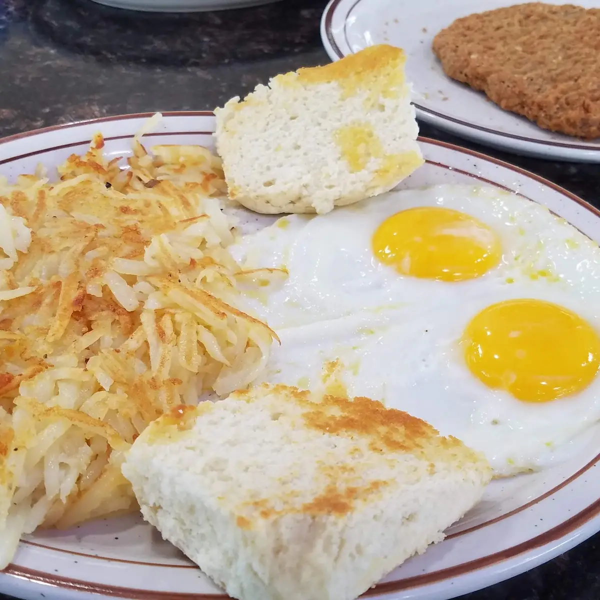 Country Fried Steak with Hashbrowns Eggs and Biscuits