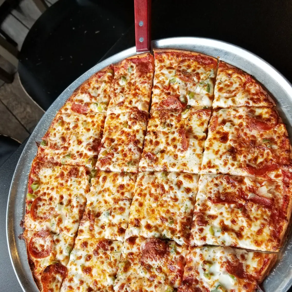 Thin Crust Pepperoni Onion and Green Peppers Pizza