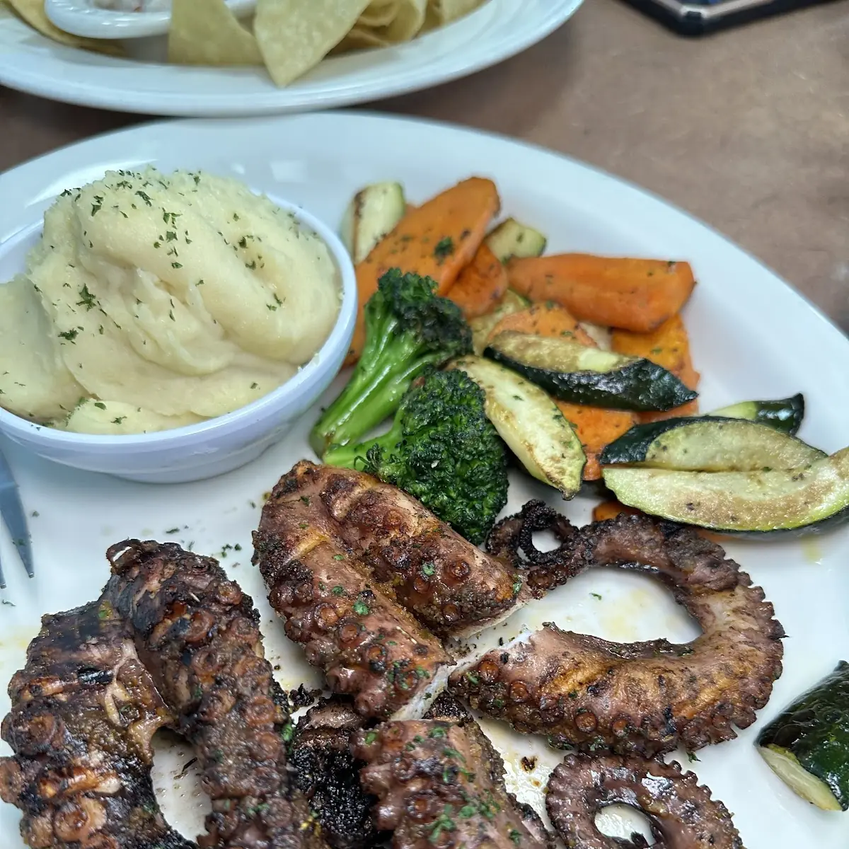 Grilled Octopus with Sauteed Mushrooms and Creamed Spinach