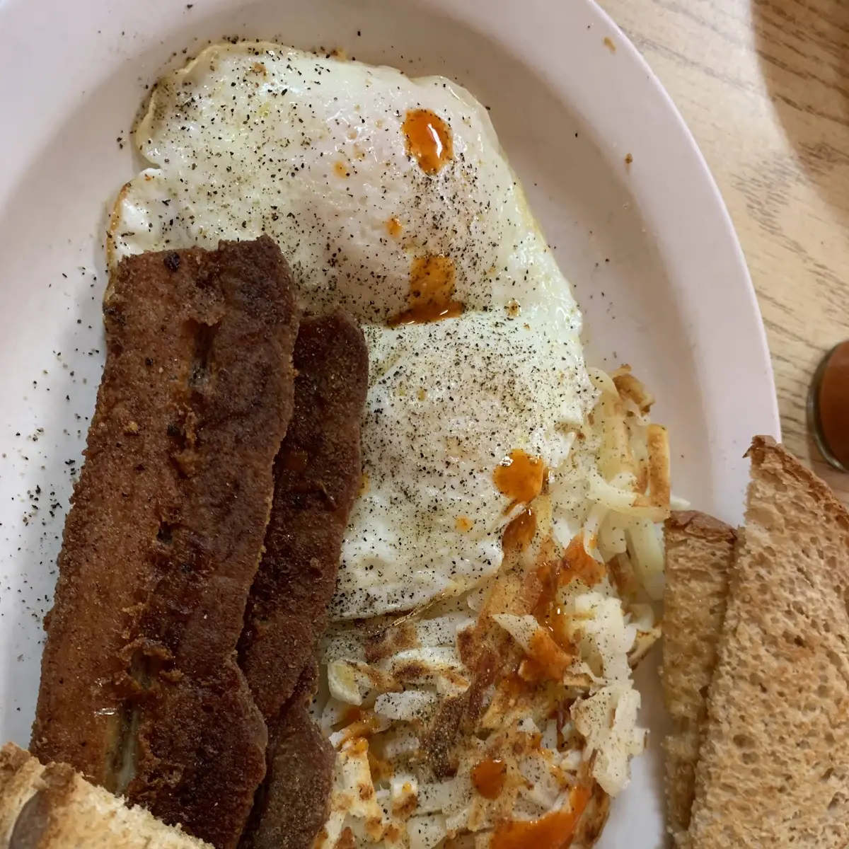 Fried Eggs with Hash Browns and Side Pork